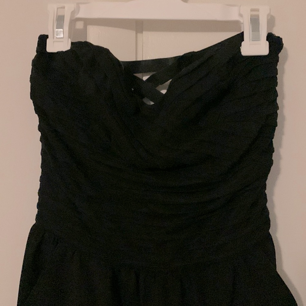 Strapless jumpsuit with pockets! Wrap front bustier with  strappy back detail.